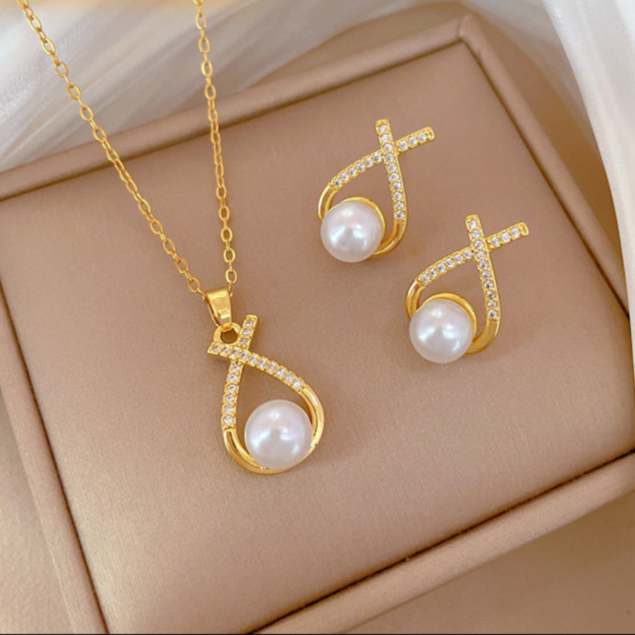 Conjunto nudo cruzado de piedras con perla