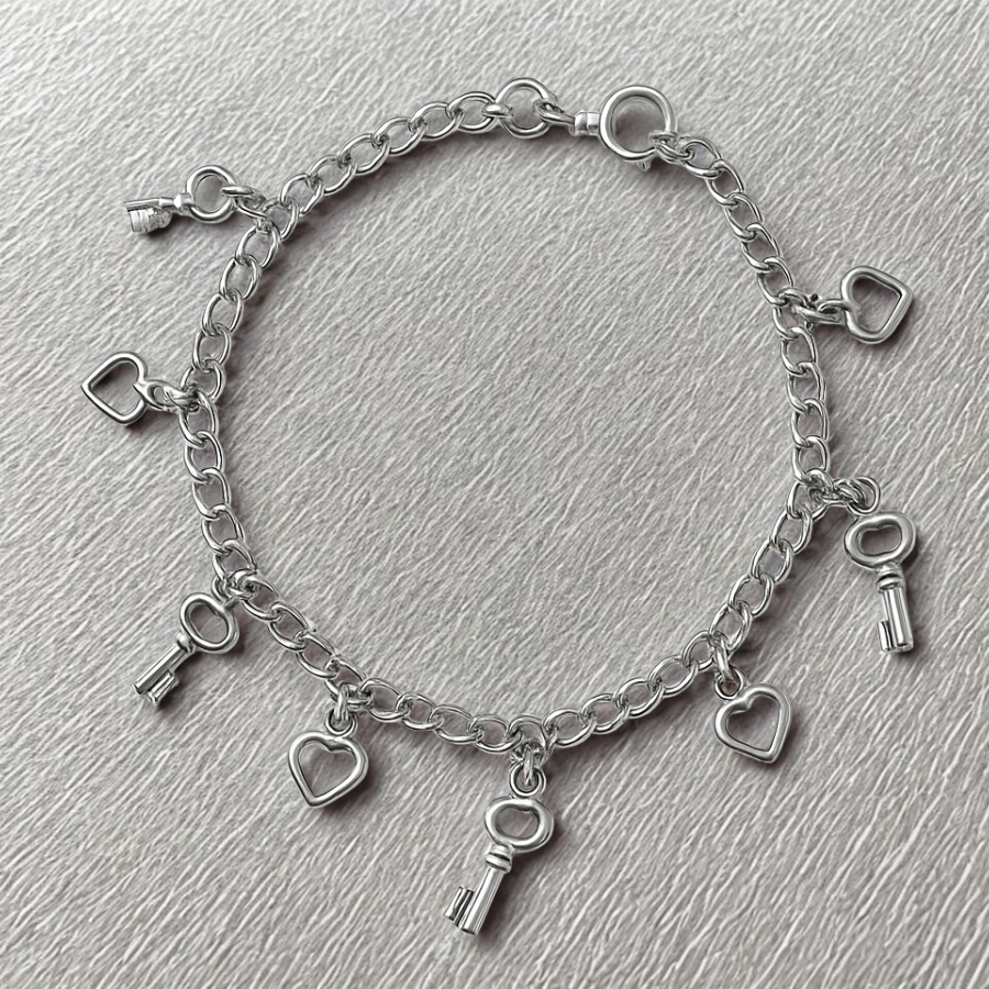 Pulsera corazón y llaves, 8 dijes, 19cm en plata 925