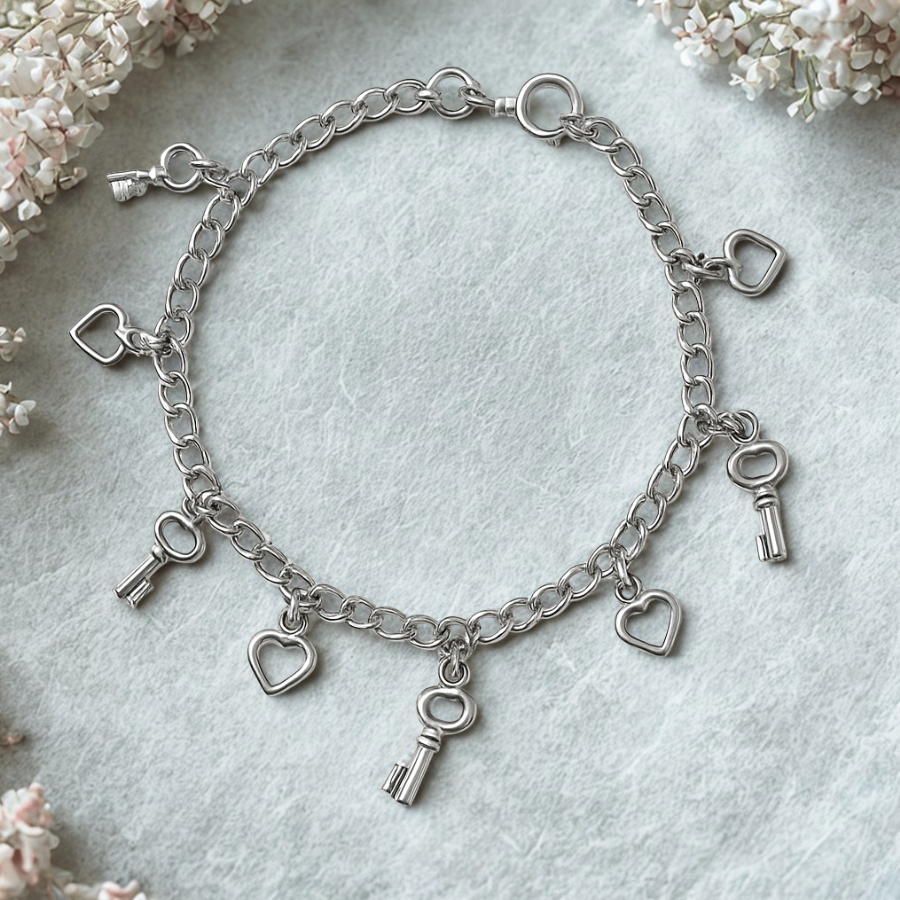 Pulsera corazón y llaves, 8 dijes, 19cm en plata 925